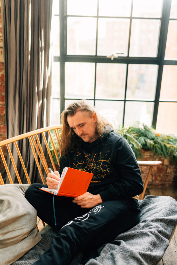 Man using the Positive Wellness Journal.